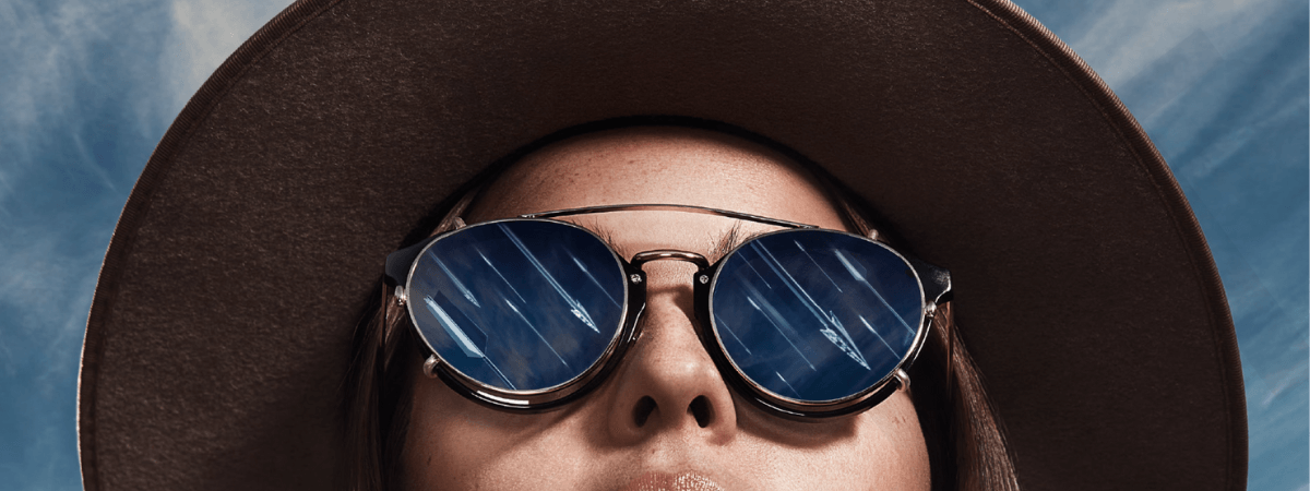 Woman wears a widebrimmed hat in still from campaign