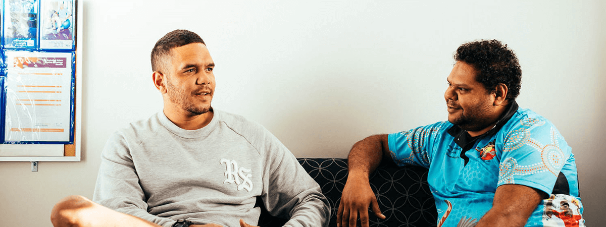 Two male Aboriginal Health Workers having a yarn