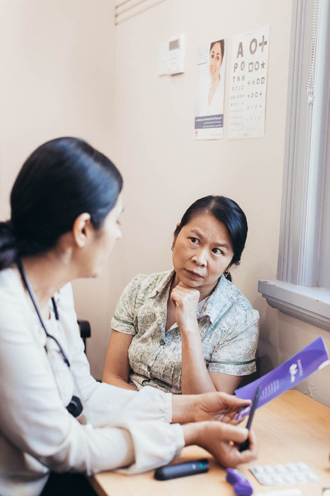 A woman speaks with her doctor about smoking cessation
