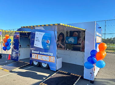 The Bowel Screening Get Behind It van in action in a carpark