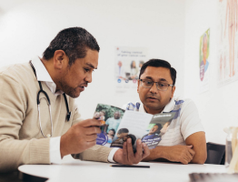 A GP speaking with his patient about smoking cessation