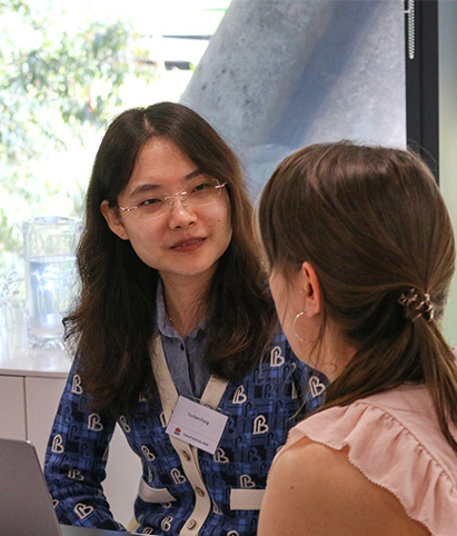 A closeup of a scientist working on models in a lab
